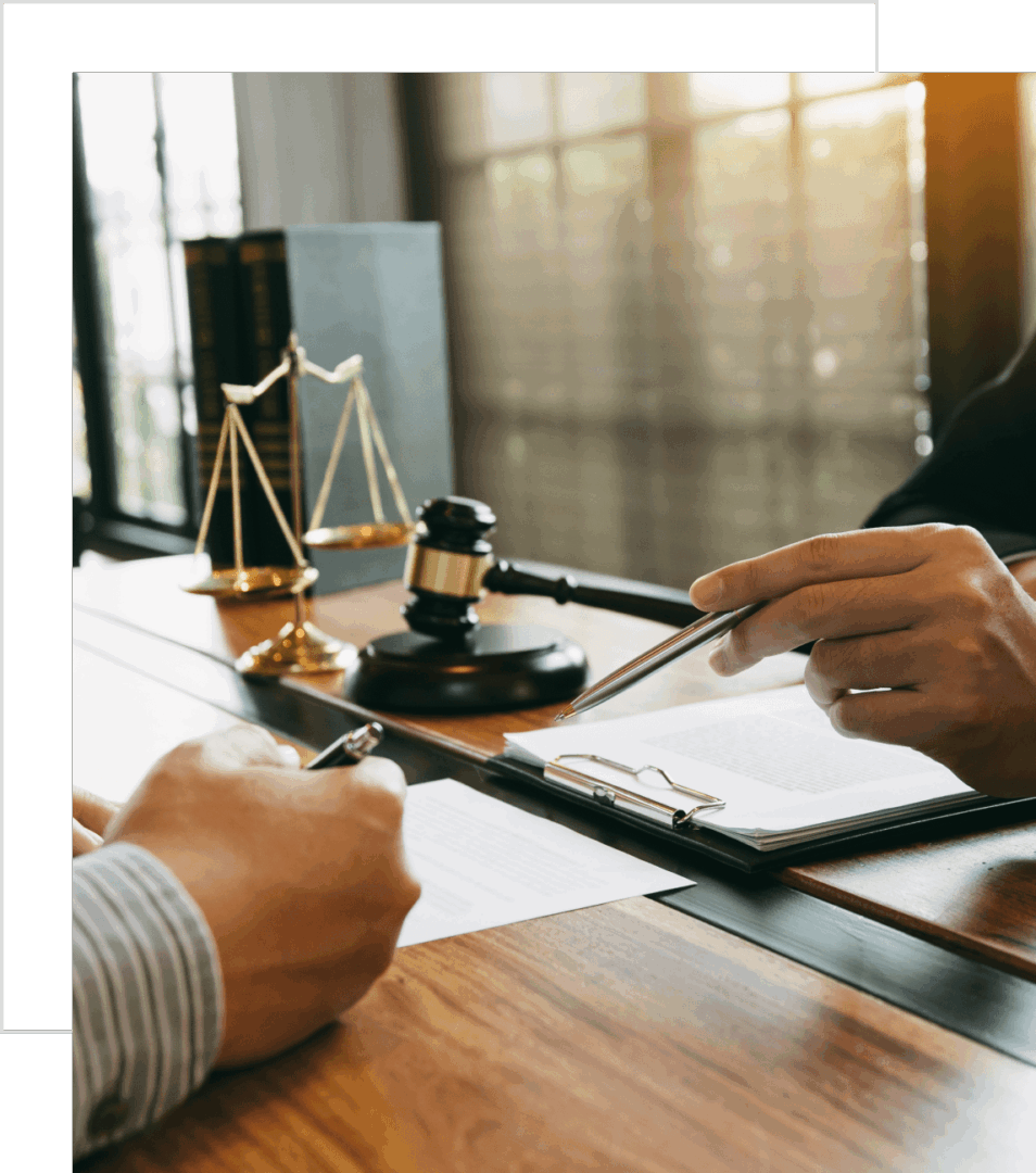 Lawyers discussing a case with legal scales and gavel.